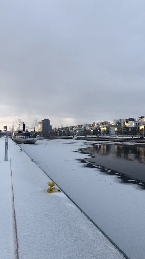 City in Winter with River