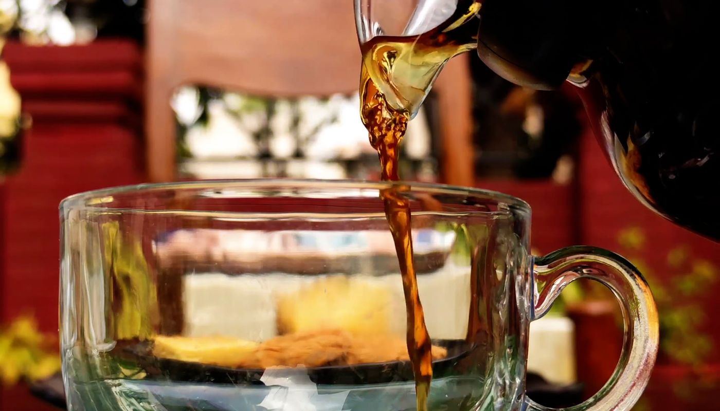 new years resolutions tips — Close up on Pouring Tea to Glass. Photo: Pexels