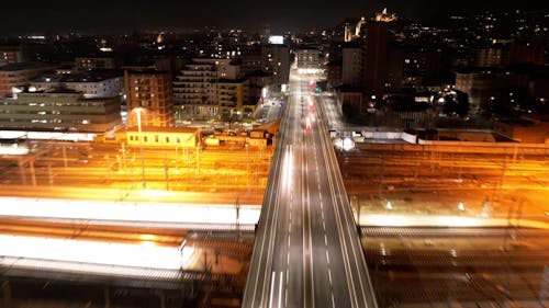 Hyperlapse Drone Footage of a City Highway at Night
