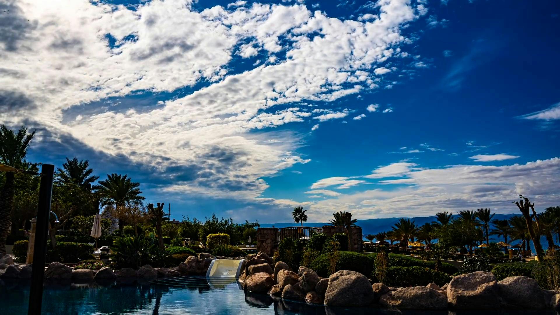 Clouds in Blue Sky over Tourist Resort · Free Stock Video
