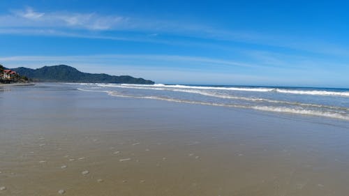 Sea Waves on Beach near Town