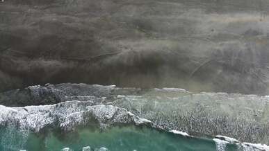 view from above on waves on shore