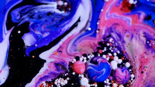 Close up of Bubbles in a Multicolor Liquid Mixture  
