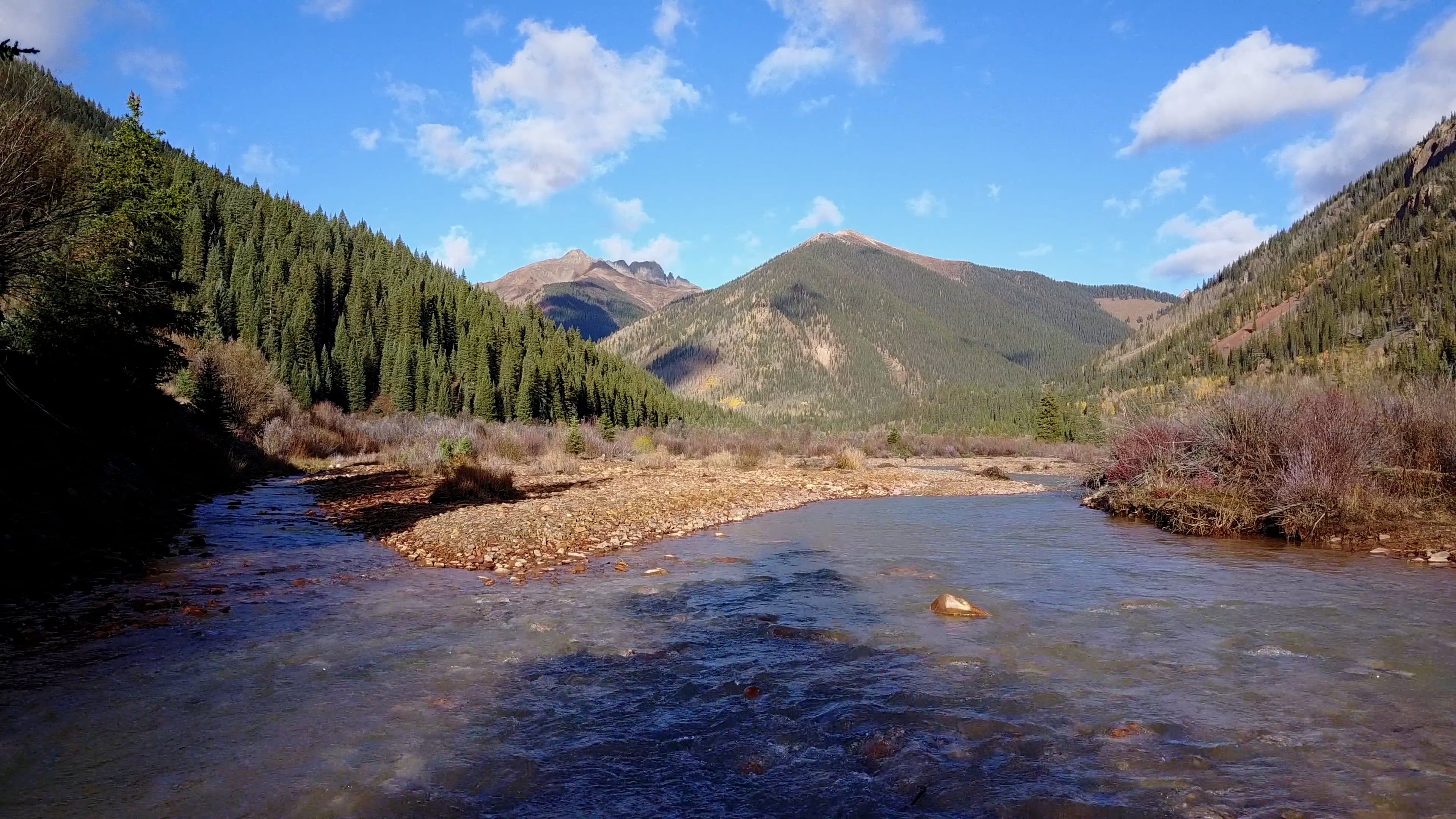 Drone Video of a Creek Flowing in a Mountain Landscape Free Stock Video ...
