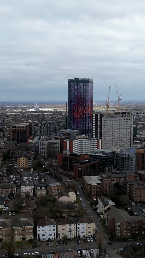 Skyscraper in City under Clouds