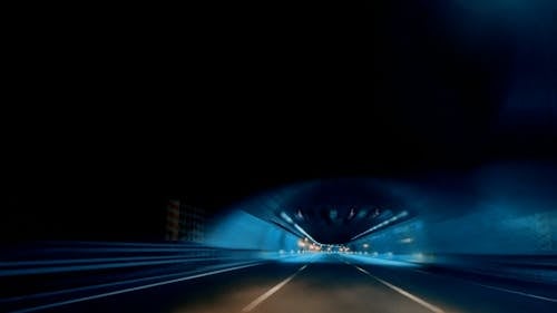 Going through an illuminated tunnel 