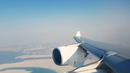 Aerial View of Dubai City from an Airplane Window 