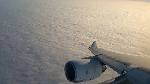 Airplane Window View from above the Clouds
