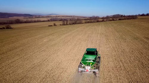 Tractor with Machinery on Field