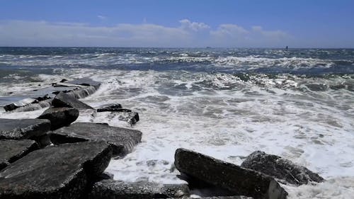 Sea Waves Hitting Stones on Shore