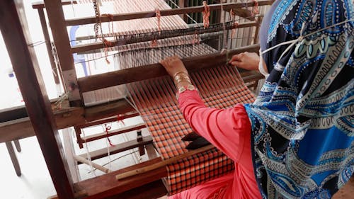 Woman in Head Scarf Operating Loom in An Giang, Vietnam