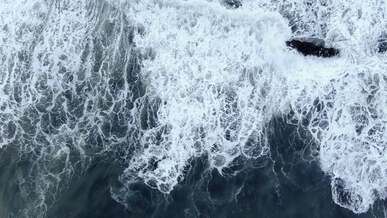 view from above on waves on shore