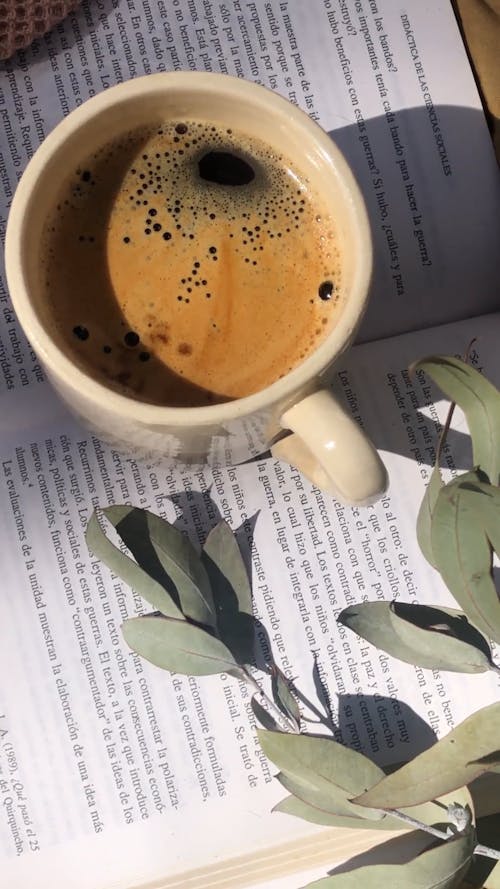 Close-up View of Coffee Cup on Book