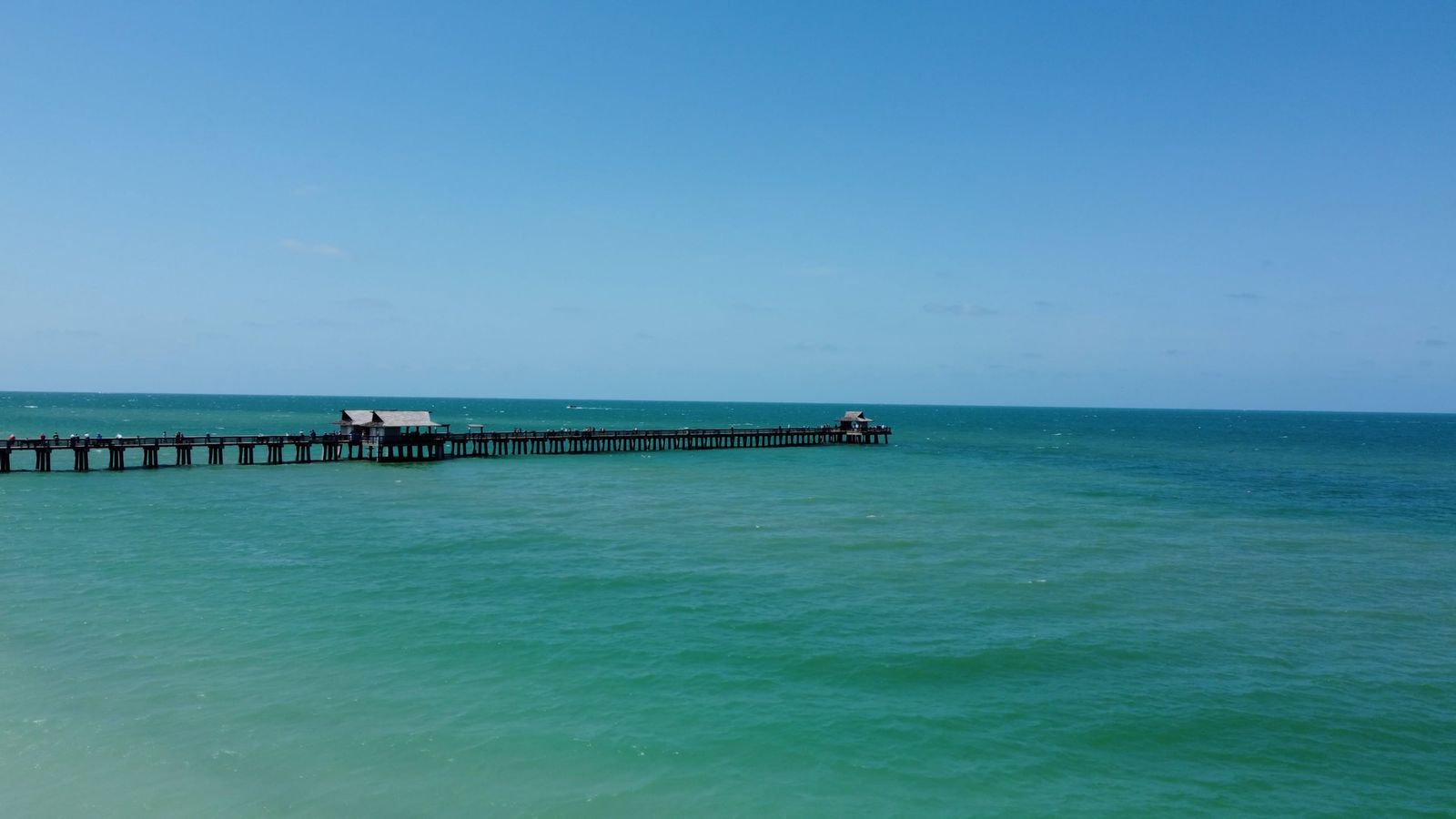 Naples Pier reaching into the Gulf of Mexico at Naples, Florida