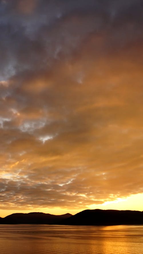 Time Lapse of a Cloudy and Colorful Sunset Sky
