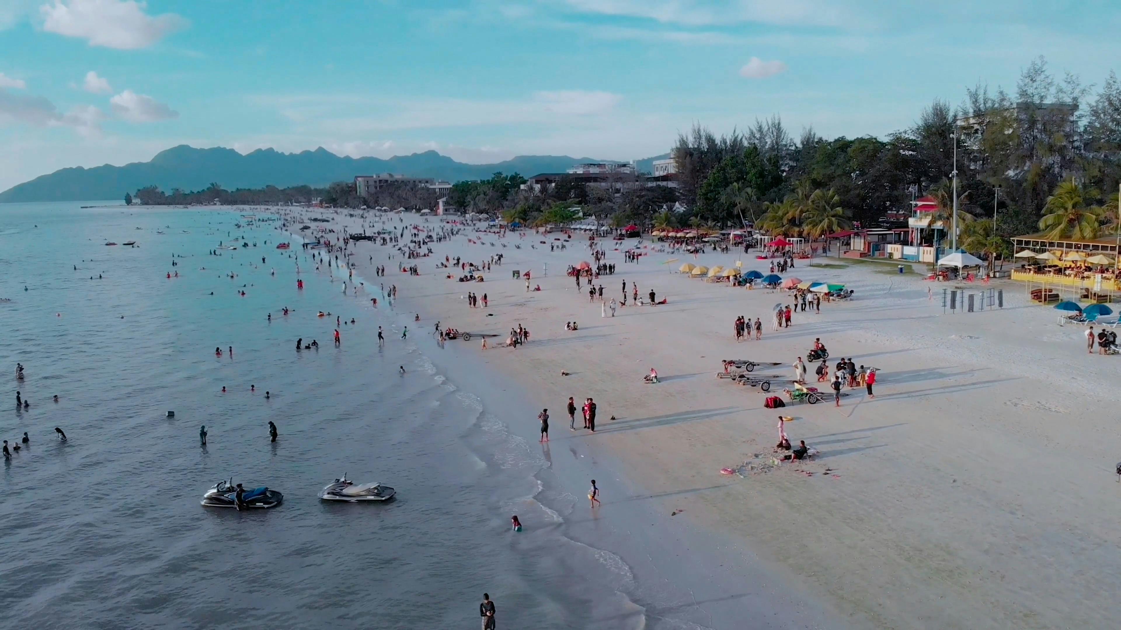 People at Beach near City · Free Stock Video