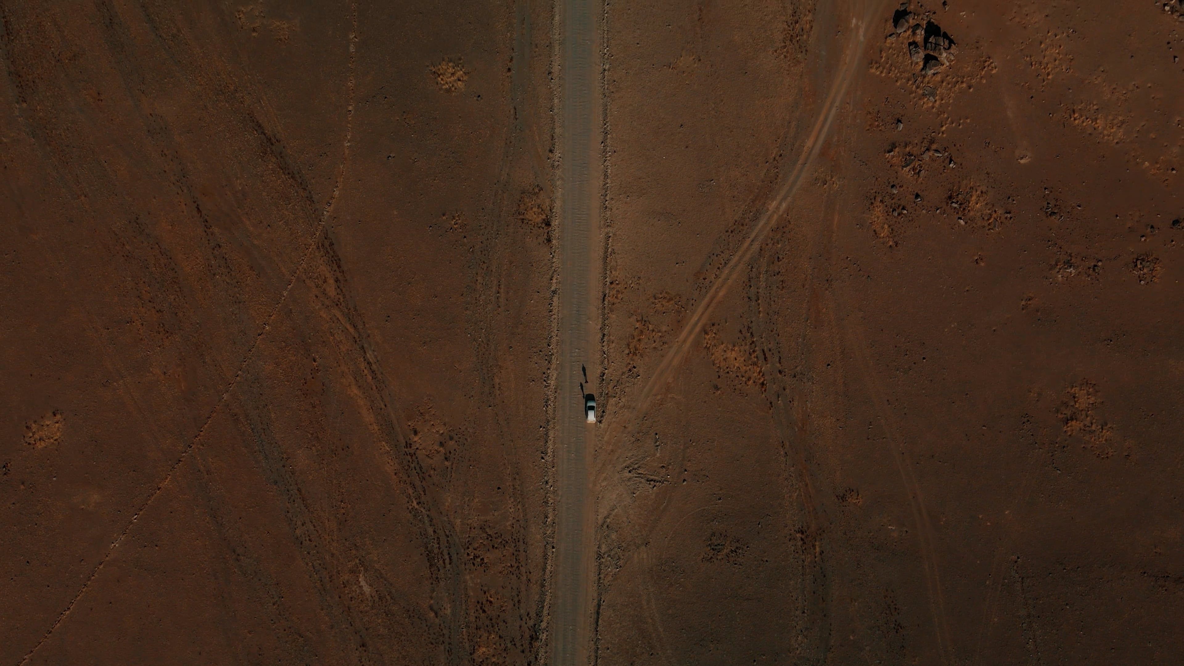 Top View of a Car Parked on a Remote Desert Road Free Stock Video ...