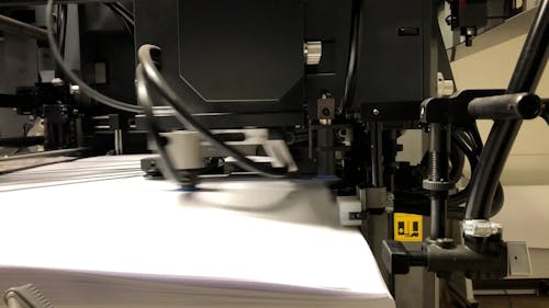 Close up of an Industrial Printing Machine Working 