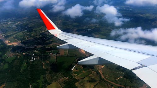 View of Airplane Wing and Clouds