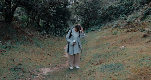 A Young Woman Hiking in a Forest