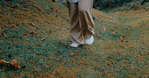 A Young Woman Going up a Hill