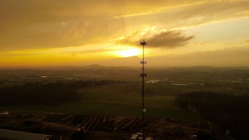 Drone Footage of Cell Tower Against Sunset