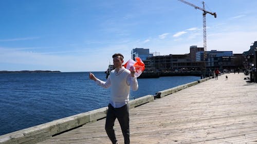Slow Motion of Man Walking with Canadian Flag