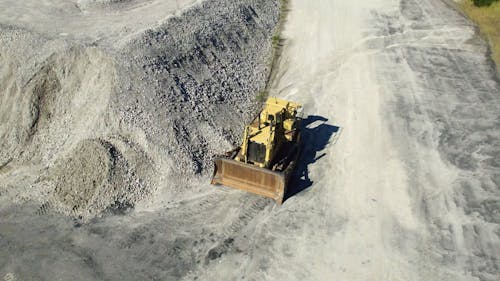 Drone Footage of a Bulldozer at an Excavation Site