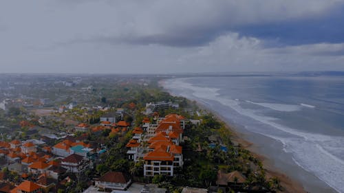 Drone Video of a Coastal Town under a Cloudy Sky