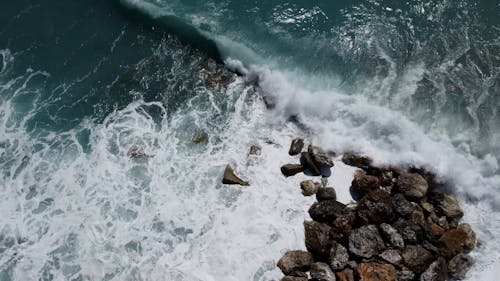 High Angle View of Sea Waves Reaching a Rocky Shore