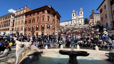people by fountain in rome