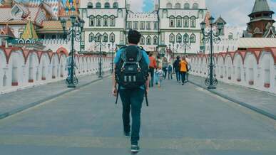 back view of a man walking towards the kremlin in moscow