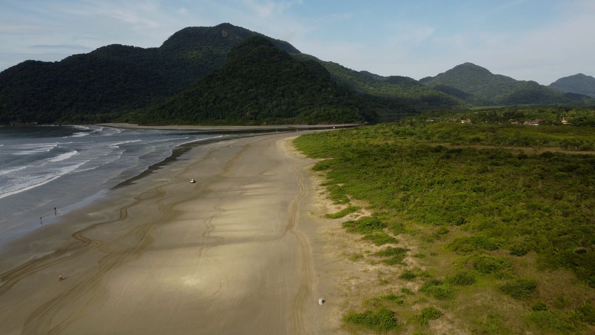 Drone Footage of a River Flowing by Green Mountains Free Stock Video ...