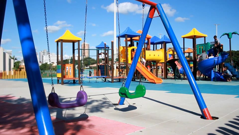A child swinging on a playground swing