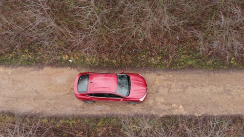 Top View of Red Car on Rural Road