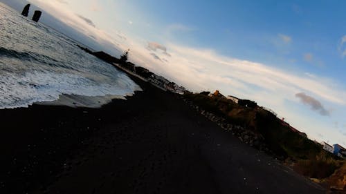 Drone Footage of a Volcanic Island Beach at Sunset
