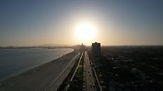 Sun over City by Sea Shore