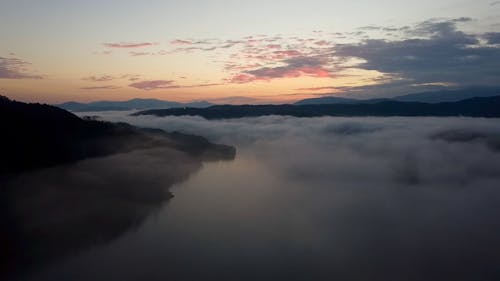 Low Clouds over a River at Sunrise