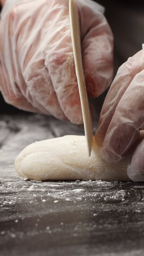 Close-up View of Cutting Dough