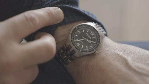 Male Hands Showing Watch
