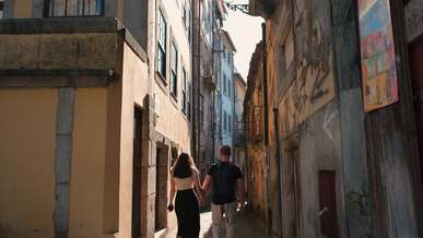 couple holding hands and walking