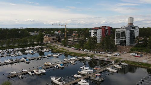 Drone Footage of Watercrafts Docked at a Coastal Town Port