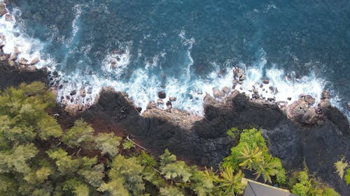 Top View of Breaking Waves on a Rocky Shore 