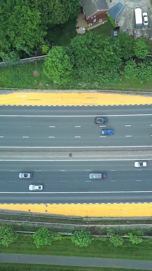 Top View of Vehicles Driving along a Busy Expressway