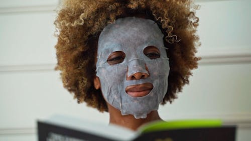 Close up of a Woman in a Sheet Mask 