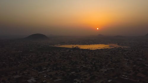 Drone Footage of the Town of Korhogo at Sunset 