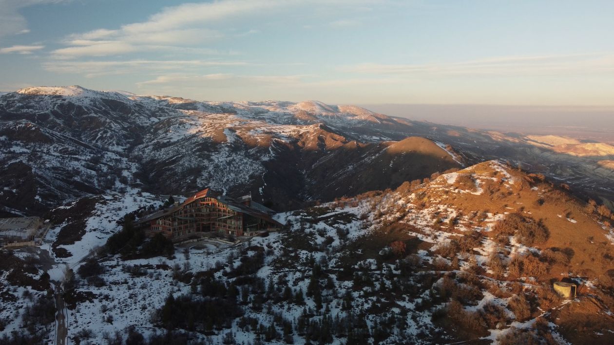 Drone Footage of a Hotel in a Snowy Mountain Landscape Free Stock Video ...