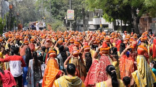 Crowd of Women Carrying Religious Offerings on Heads During a Hindu Festival