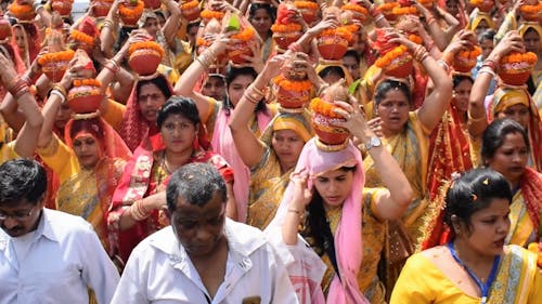Crowd of Women Carrying Religious Offerings on Heads During a Hindu Festival