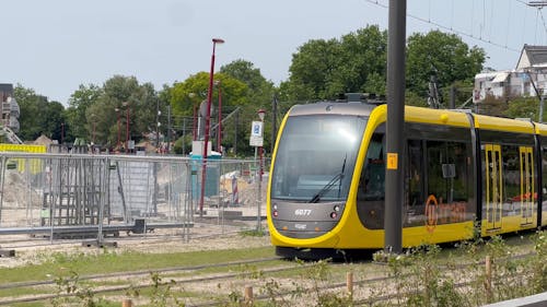 Tram Train Moving Along Tracks